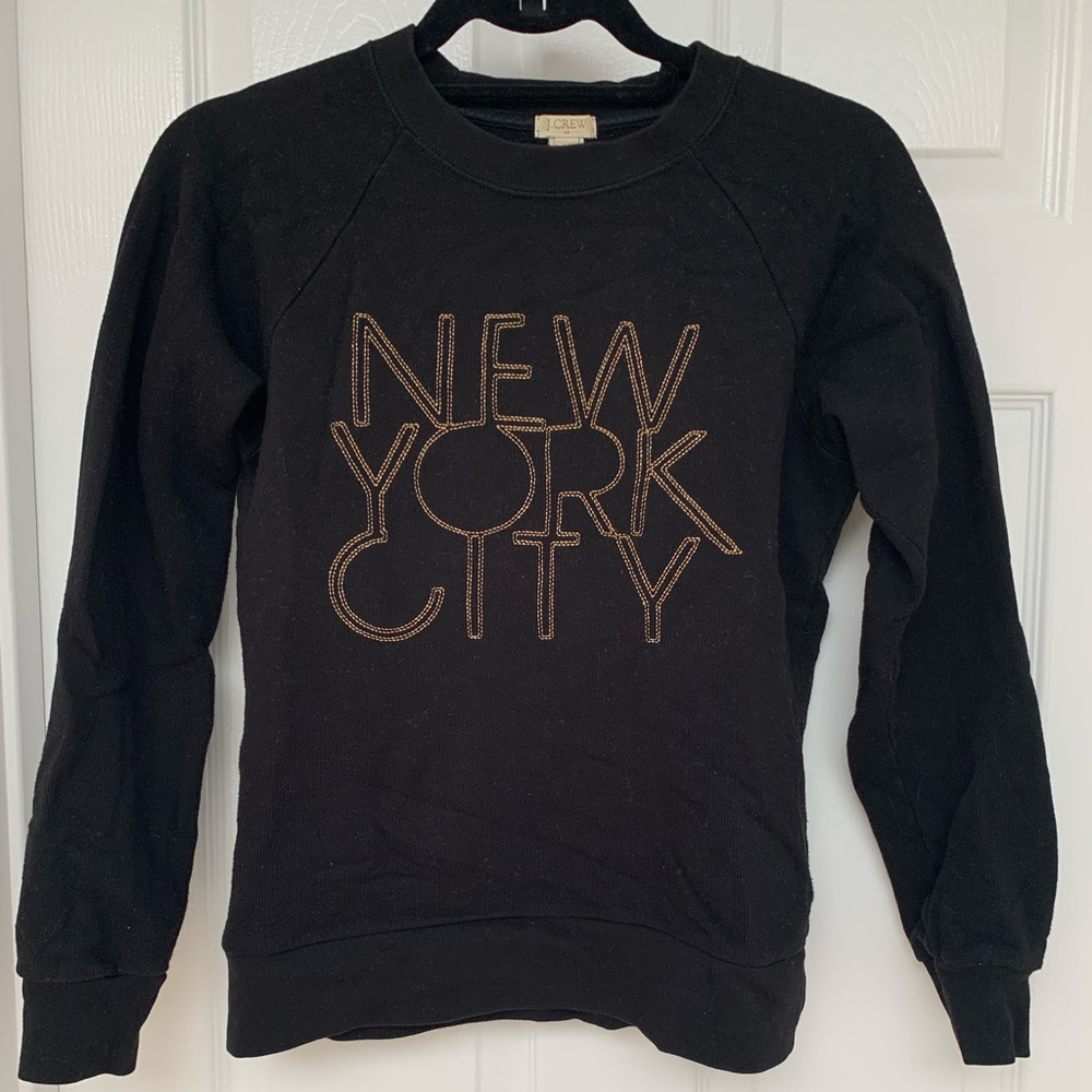 Black crewneck sweatshirt with embroidered lettering